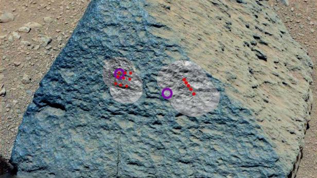 REUTERSThis NASA image from Mars Curiositys Mast Camera taken on September 22, 2012 and released October 11, 2012 shows where NASAs Mars Curiosity rover aimed two different instruments to study a rock known as "Jake Matijevic." The red dots are where the