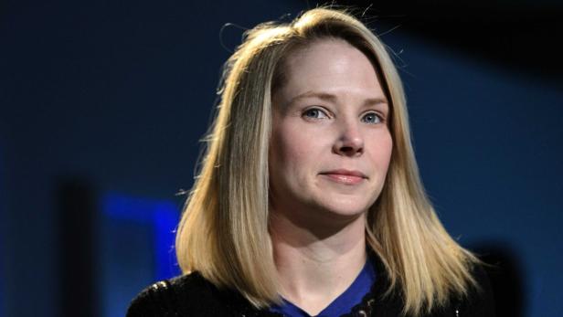 dapdFILE - In this Friday, Jan. 25, 2013, file photo, Marissa Mayer, CEO of Yahoo!, listens during the 43rd Annual Meeting of the World Economic Forum, in Davos, Switzerland. Yahoo showed more signs of progress during the fourth quarter of 2012m, as the I
