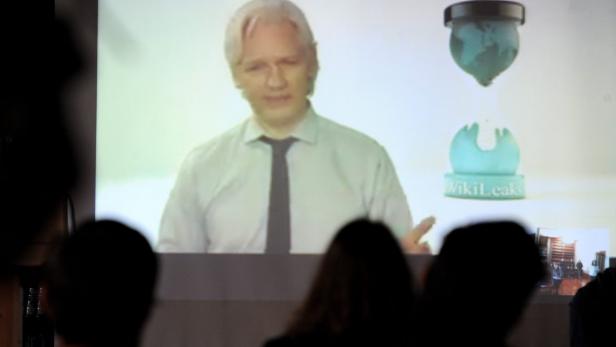 EPAepa03800377 Wikileaks Party candidate Julian Assange speaks from London during the official launch and announcement of Senate candidates in Melbourne, Australia, 25 July 2013. Mr Assange is still in the Ecuadorian embassy in London, Britain, to avoid e