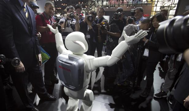 Honda Motor's Asimo robot puts on a demonstration for the media at the Jacob Javits Convention Center during the New York International Auto Show in New York