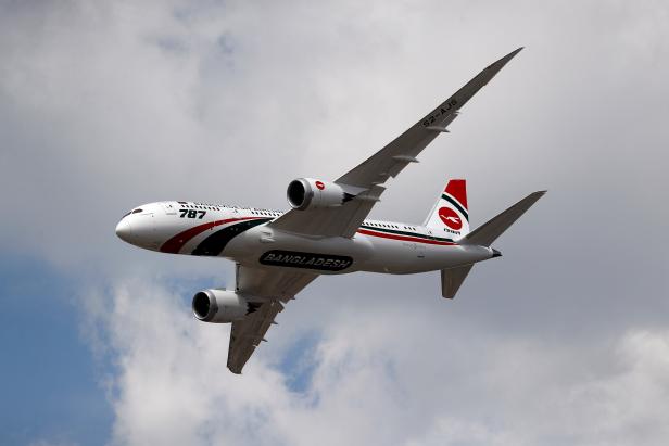 A Boeing 787 puts on a display at the Farnborough Airshow, in Farnborough