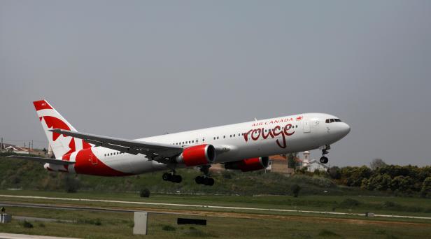 FILE PHOTO: An Air Canada Boeing 767 plane lands at Lisbon's airport