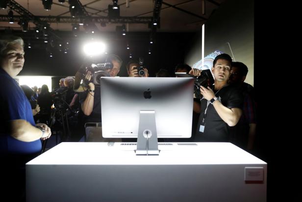 FILE PHOTO: Members of the media photograph a prototype iMac Pro during the annual Apple Worldwide Developer Conference (WWDC) in San Jose