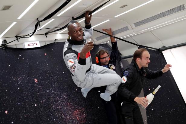 Retired sprinter Usain Bolt and French Interior designer Octave de Gaulle enjoy zero gravity conditions during a flight in a specially modified plane above Reims