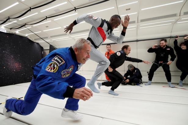 Retired sprinter Usain Bolt, French astronaut Jean-Francois Clervoy and French Interior designer Octave de Gaulle enjoy zero gravity conditions during a flight in a specially modified plane above Reims