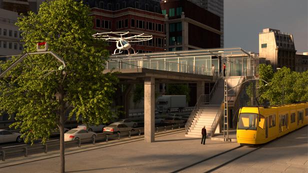 Ein autonomes Flugtaxi landet an einer Haltestelle in einer Stadt.