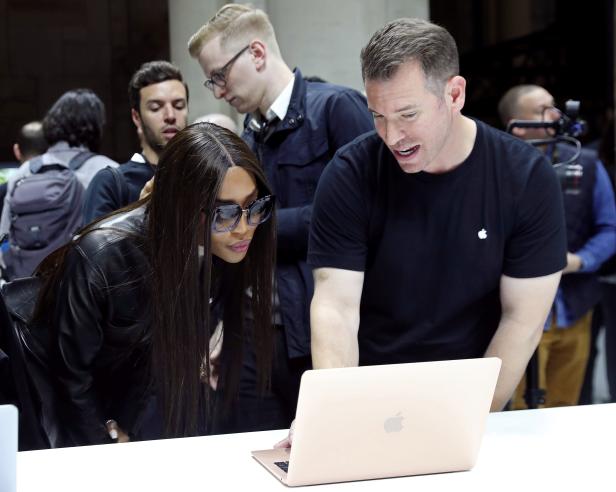 Model Naomi Campbell tries out the new Macbook Air during an Apple launch event in the Brooklyn borough of New York