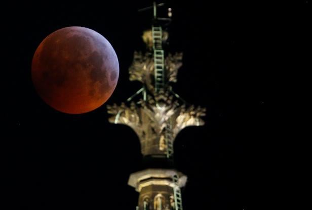 The "super blood wolf moon" is seen during a total lunar eclipse behind the gothic cathedral in Cologne