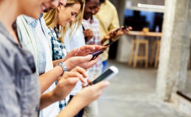 Group of people using their smart phones