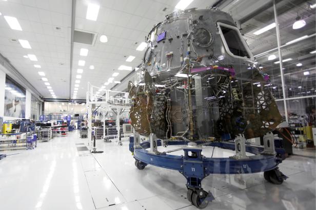 The SpaceX space craft Crew Dragon is shown being built inside a cleanroom at SpaceX headquarters in Hawthorne, California