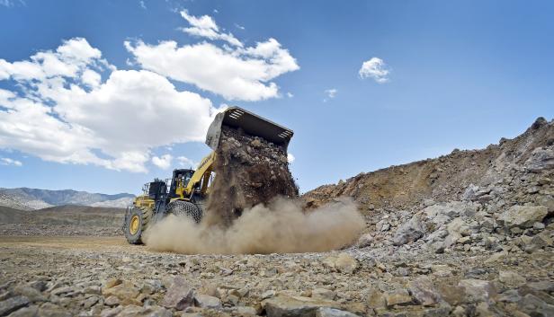 A front-end loader is used to move material inside open pit at Molycorp's Mountain Pass Rare Earth facility in Mountain Pass, California