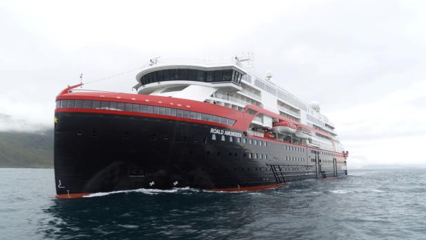 Hurtigruten's cruise ship MS Roald Amundsen is seen in the sea near Ulsteinvik