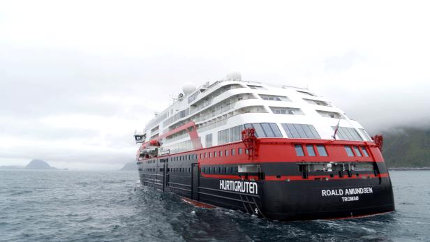 Hurtigruten's cruise ship MS Roald Amundsen is seen in the sea near Ulsteinvik