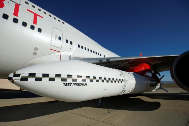 Richard Branson's Virgin Orbit, with a rocket underneath the wing of a modified Boeing 747 jetliner, prior to its takeoff on a key drop test of its high-altitude launch system for satellites from Mojave, California