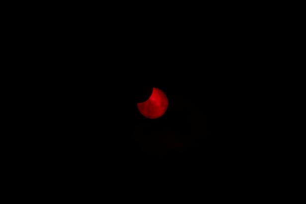 An annular solar eclipse is observed with the use of a solar filter in Siak, Riau province