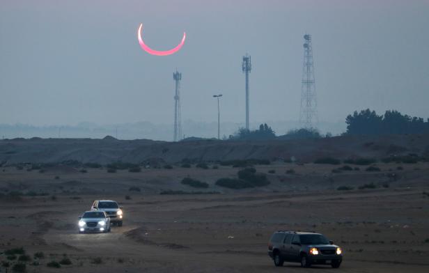 Solar eclipse is seen during the early hours on Jabal Arba (Four Mountains) in Hofuf