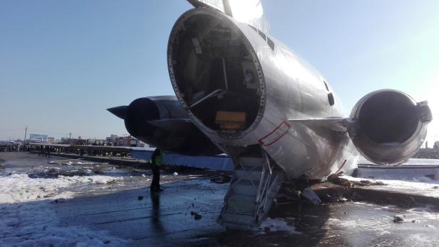 Iranian passenger plane is seen after sliding off the runway upon landing at Mahshahr airport