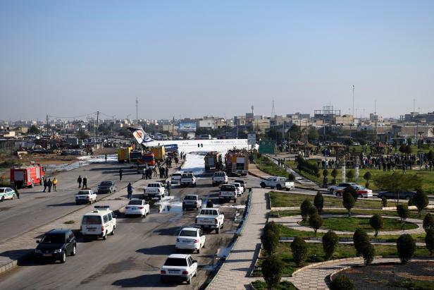 Iranian passenger plane is seen after sliding off the runway upon landing at Mahshahr airport