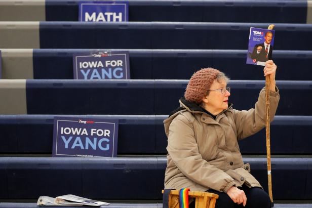 A supporter of Democratic 2020 presidential candidate Steyer waits at her caucus site in Des Moines