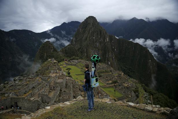 Daniel Filip, Tech Lead Manager for Google Maps, carries the Trekker, a 15-camera device, while mapping the Inca citadel of Machu Picchu for Google Street View in Cuzco