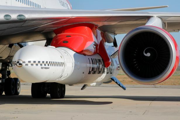 Richard Branson's Virgin Orbit, with a rocket underneath the wing of a modified Boeing 747 jetliner, prior to its takeoff on a key drop test of its high-altitude launch system for satellites from Mojave, California