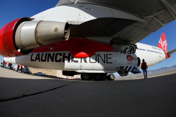 Richard Branson's Virgin Orbit, with a rocket underneath the wing of a modified Boeing 747 jetliner, prior to its takeoff on a key drop test of its high-altitude launch system for satellites from Mojave, California