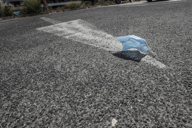 Discarded latex gloves and protective face masks