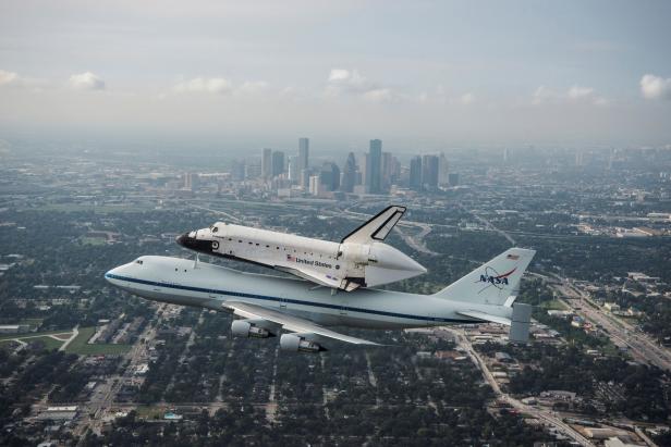 FILE PHOTO: Handout of the space shuttle Endeavour, atop NASA's Shuttle Carrier Aircraft at it flies over Houston