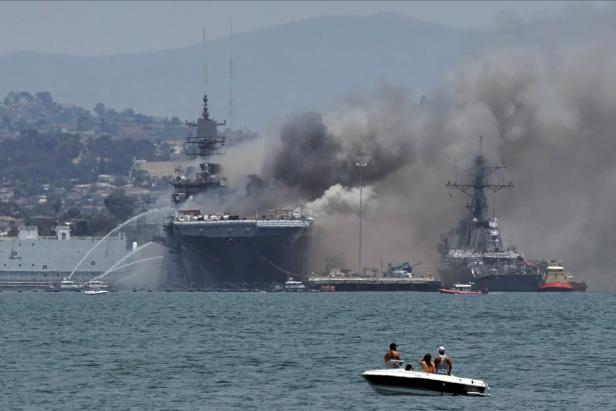 Smoke rises from a fire on board the U.S. Navy amphibious assault ship USS Bonhomme Richard at Naval Base San Diego