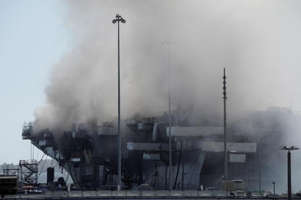 Smoke rises from a fire on board the U.S. Navy amphibious assault ship USS Bonhomme Richard