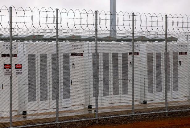 A fence surrounds the Hornsdale Power Reserve, featuring the world's largest lithium ion battery made by Tesla, during the official launch near the South Australian town of Jamestown