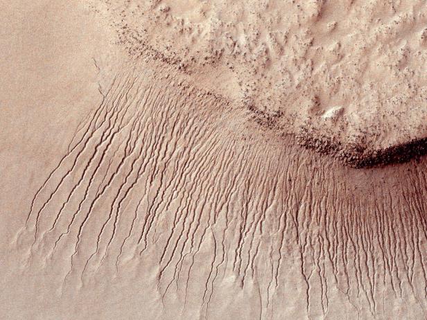 Portions of the Martian surface are pictured from NASA's Mars Reconnaissance Orbiter