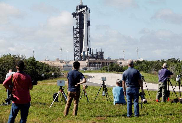 A SpaceX Falcon 9 rocket and Crew Dragon capsule is readied for launch in Cape Canaveral