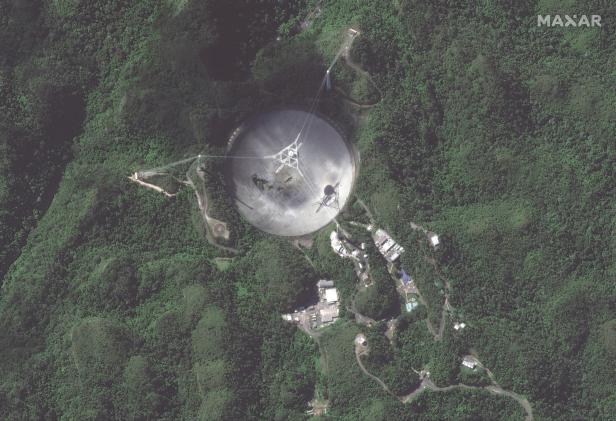 An overview of the damaged Arecibo Observatory radio telescope is seen in Arecibo, Puerto Rico