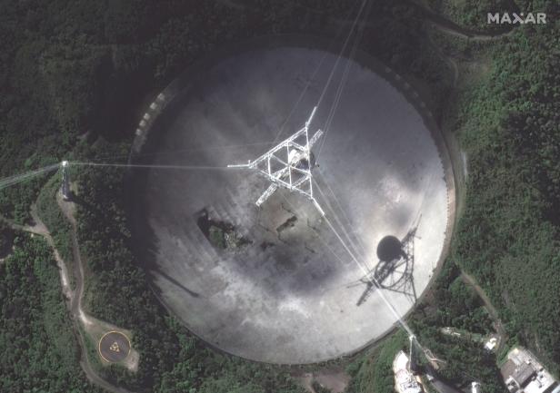 A close-up view of the damaged Arecibo Observatory radio telescope is seen in Arecibo