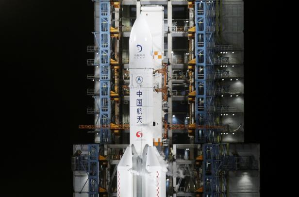 The Long March-5 Y5 rocket, carrying the Chang'e-5 lunar probe, is seen before taking off from Wenchang Space Launch Center, in Wenchang