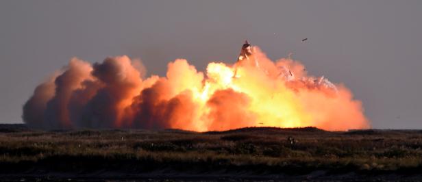 SpaceX's first super heavy-lift Starship SN8 rocket explodes during a return-landing attempt after it launched from their facility on a test flight in Boca Chica, Texas