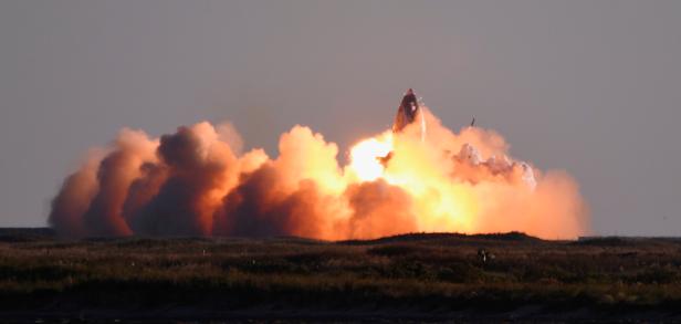 SpaceX's first super heavy-lift Starship SN8 rocket explodes during a return-landing attempt after it launched from their facility on a test flight in Boca Chica, Texas