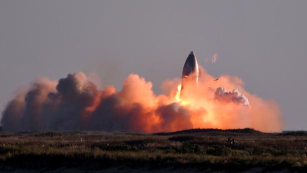 SpaceX's first super heavy-lift Starship SN8 rocket explodes during a return-landing attempt after it launched from their facility on a test flight in Boca Chica, Texas