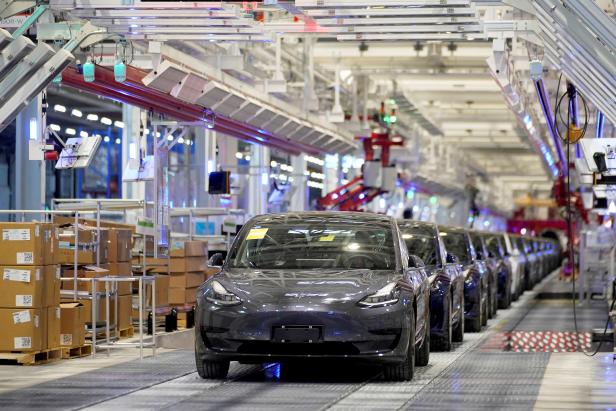 FILE PHOTO: FILE PHOTO: Tesla China-made Model 3 vehicles are seen during a delivery event at its factory in Shanghai