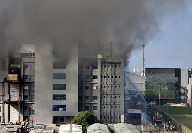 Firefighters try to douse a fire that broke out inside the complex of the Serum Institute of India, in Pune