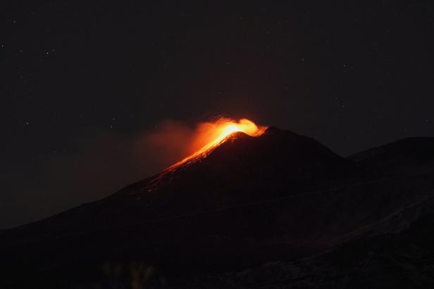 Mount Etna lights up the sky