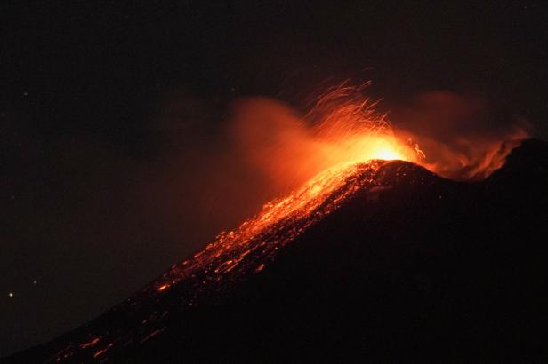 Mount Etna lights up the sky