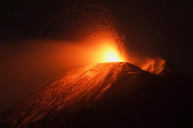 Mount Etna lights up the sky