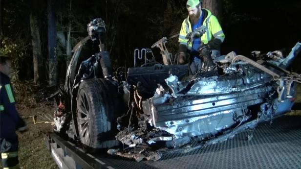 The remains of a Tesla vehicle are seen after it crashed in The Woodlands, Texas