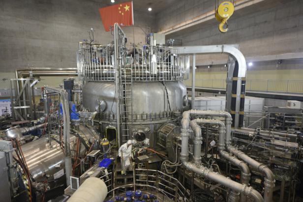 Technician works on the Experimental Advanced Superconducting Tokamak (EAST) in Hefei