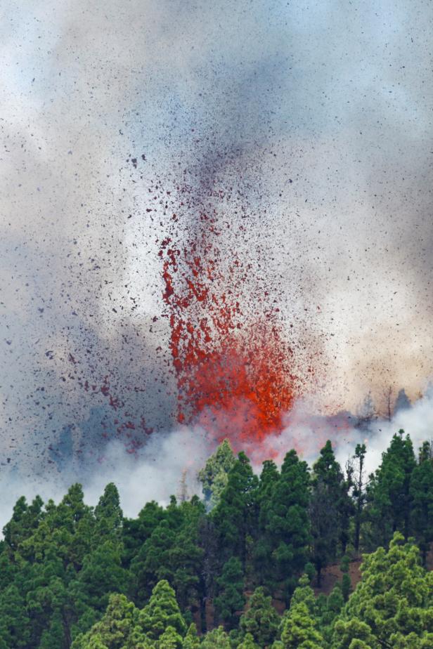 Lava and smoke rise following the eruption of a volcano in Spain