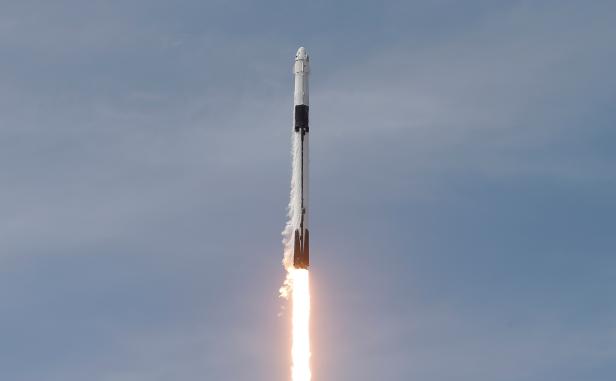 A SpaceX Falcon 9 rocket and Crew Dragon spacecraft carrying NASA astronauts Douglas Hurley and Robert Behnken lifts off
