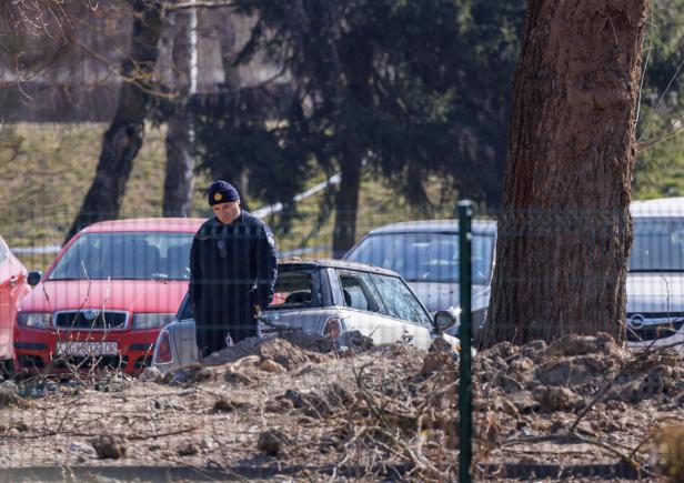 A police officer stands at a drone crash site, following Russia's invasion of Ukraine, in Zagreb