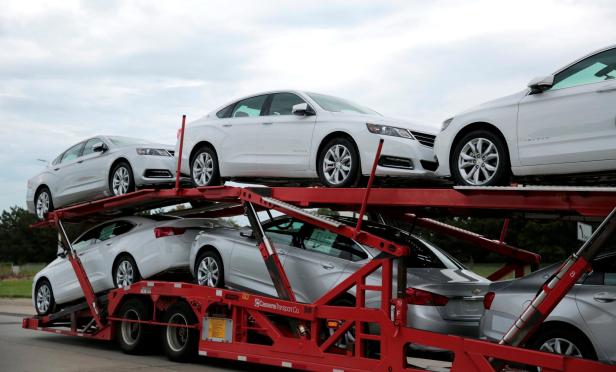 FILE PHOTO: Car hauler transports newly built Chevrolet Impalas from the General Motors Detroit-Hamtramck plant in Detroit